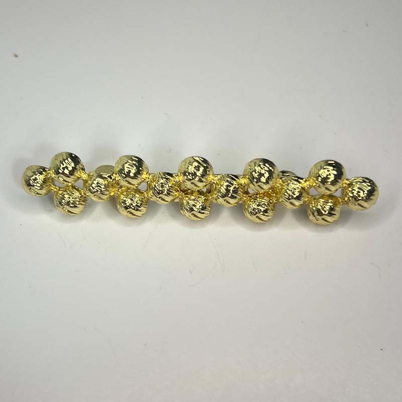 Broche Bolas